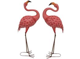 She has blue and pink feather makeup around her eyes. Set Of 2 Pink Metal Flamingos 15 W X 41 H Steinhafels