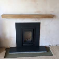Uk oak has invested heavily in milling equipment to provide a truly comprehensive solution to all structural oak requirements! Stovax Stove Installed In Cambridge Black Granite Hearth Surround Oak Beam Modern Living Room Cambridgeshire By Cambridge Stove Installations Houzz