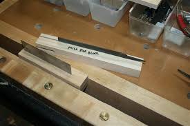 Most of the time, in my shop, i use my stationary disc sander and a jig that fits into the miter gauge slot to rough out the angle. Me Sharpening A Card Scraper