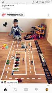 Child S Play Streets Marked In Tape On A Floor Bebek Oyun Yeni Yuruyen Bebek Aktiviteleri Oyun Odasi