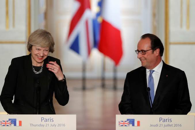 France's Hollande urges UK to deliver Brexit soon but offers May some time | Reuters