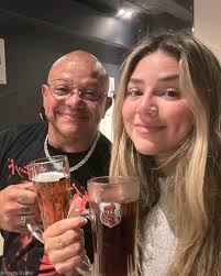 Rey Mysterio with his daughter, drinking beer.