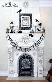 The raven halloween mantel with. 18 Spooktacular Halloween Ideas For Your Fireplace Mantel