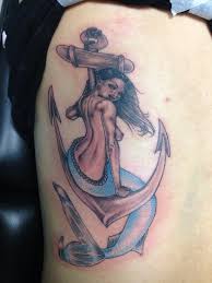 Awesome golden and green color ink mermaid and anchor tattoo on boy shoulder. Cool Mermaid Anchor Tattoo Amazing Tattoo Ideas