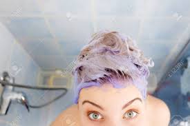4) strip black hair dye out and dye your hair blonde in one go. Woman Applying Coloring Shampoo On Her Hair Female Having Purple Stock Photo Picture And Royalty Free Image Image 111572680