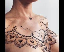 This chest tattoo looks great with a henna design. Chest Henna Henna Tattoo Designs Henna Inspired Tattoos Henna Tattoo Designs Simple