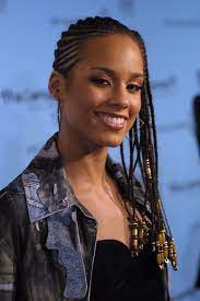 This hairstyle is very easy to plait as all you need do is to pack the curly hair, braiding five thin cornrows on one side and draw up the hair with a hair clip. Mane Moments 11 Times Alicia Keys Had Us Fallin For Her Hairstyles