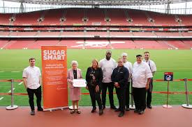 A plot of land was leased in the borough of highbury, and a stadium got designed by archibald leitch. Arsenal Stadium Joins Sugar Smart Campaign As Part Of Islington Launch Sustain