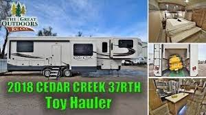Maybe you would like to learn more about one of these? New Luxury Toy Hauler 2018 Cedar Creek 37rth Rear Garage Front Living Room Fifth Wheel Colorado Youtube