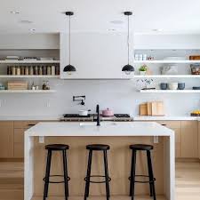 It is a new installation. The Solna Single Handle Pull Down Kitchen Faucet In Matte Black Accents A High Contrast Symmetrical Kitchen De Kitchen Design Home Kitchens Minimalist Kitchen