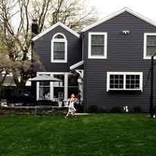 Dark gray house with maroon shutters. 52 Gray Houses Ideas In 2021 House Colors House Exterior Exterior House Colors