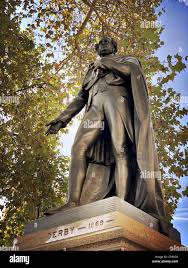 A low angle shot of the Statue of the Earl of Derby in Parliament Square,  London during autumn. Sculpture by Matthew Noble completed in 1874 Stock  Photo