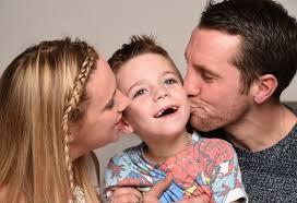 Who are Ollie and Amelia Carroll, what is Batten disease and have parents  Lucy and Mike spken about NHS treatment?