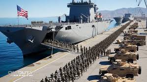 NEW: A Marine expeditionary unit with 2,200 Marines aboard three U.S. Navy  amphibious ships is being ordered to the Middle East, according to two U.S.  officials.