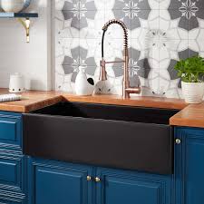 Sink is reversible with smooth (shown) or casement front visible. Black Farmhouse Sink Signature Hardware