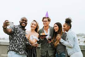 Download Premium Image Of Diverse Group Of Friends Taking A Selfie At A Birthday Party Photography Birthday Party Hats Wine Birthday Party