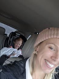 Girl wearing mini gold hoop earrings