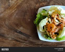 Shrimp, bell pepper, cucumber and herbs are tossed with a spicy thai dressing in this colorful salad. Top View Thai Spicy Image Photo Free Trial Bigstock