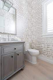 Whether with bold wallpaper, an innovative sink explore these 50 powder rooms from around the world and let us know in the comments which one is perfect for you. Gray Powder Room Washstand With White And Taupe Wallpaper Transitional Bathroom