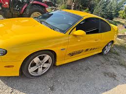 Image result for Yellow 2004 Pontiac