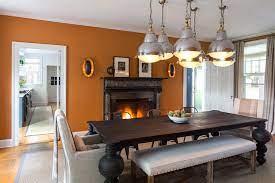With red, it can be dramatic and intense as well as giving off a sense of prosperity. Orange Dining Rooms Eclectic Dining Room Chango Co