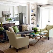 Neutral Backdrop Dark Brown Couch All Of The Color Is In The Accessories Living Room Green Open Space Living Brown Living Room