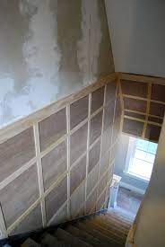 Stairway Inspiration Square Board And Batten To Hide Damaged Walls Newlywoodwards Basement Remodeling Basement Renovations Basement Decor