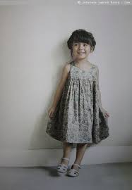 From A Sunny Spot Japanese Pattern Book Little Girls Clothes To Sew Loose Sun Dress With Gathered Skirt In Floral Cott Kids Outfits Kids Dress Girl Outfits