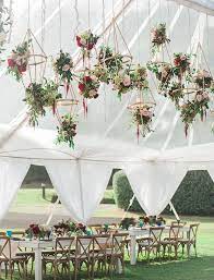 Hanging flowers from your wedding tent (like these) is a fun and unexpected touch. Wedding Decoration Ideas Floral Wedding Decorations Wedding Decorations Floral Wedding