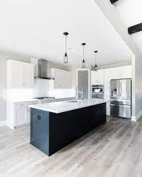 Modern Industrial White Kitchen With Black Island White Modern Kitchen Interior Design Kitchen Kitchen Design