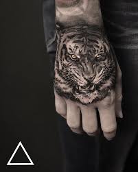 50 Stunning Tiger Head Tattoo Design Ideas January 2021 Tiger Head Tattoo Tiger Hand Tattoo Tiger Tattoo Design