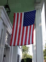 Maybe you would like to learn more about one of these? American Flag Hanging From House Stock Photo Dissolve