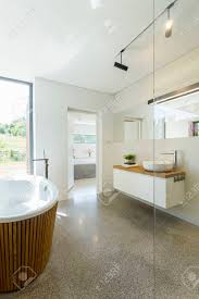 Find over 100+ of the best free bathroom design images. Bright Simple Bathroom Design With Granite Floor Large Window Stock Photo Picture And Royalty Free Image Image 82517700