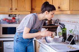 Woman Cooking At Home Stocksy United Cook At Home Cooking Women