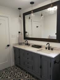 Mainly, this idea is suitable to pick when the bathroom space is quite small. Grey Bathroom Vanity With Black And White Tile White Bathroom Tiles Small White Bathrooms Small Bathroom Remodel