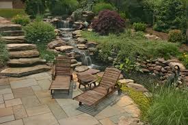 Relax On Your Own Private Patio Complete With A Waterfall And Stream Designed By The Merrifield Water Features In The Garden Outdoor Yard Ideas Ideal Gardens