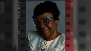 Rosetta LeNoire helps Big Bird cross the street