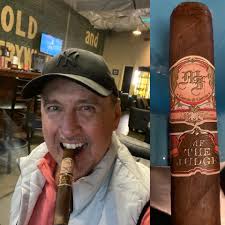 Enjoying cigar and old fashioned drink