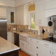 This West Warwick Ri Kitchen Features Stunning Carrera Marble Countertops With A Tumbled Stone Backsplash And Recess One Wall Kitchen Stone Backsplash Kitchen