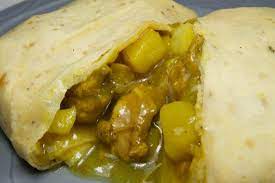 Serve with roti and a hot pepper sauce on the side. Curry Chicken Roti Wrapped Picture Of Cravins Caribbean Grill Markham Tripadvisor