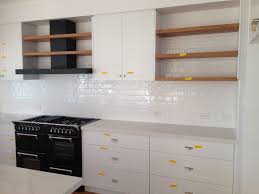 Black And White Kitchen Matt Kitchen Matt Black Rangehood To Black Cooker Stove White Subway Splashback Floating Timber Shelving Timber Kitchen Hidden Kitchen Kitchen Inspirations