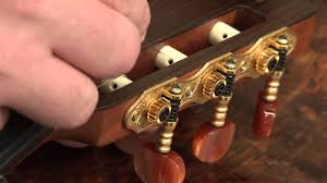 On a classical guitar, there are no pegs to remove like on a steel string guitar. Restringing Your Classical Guitar Youtube