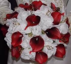 The black roses and dark flowers like calla lilies in these gothic wedding bouquets were assembled by a variety of florists showing off their. Red Roses And White Lilies Wedding Bouquet