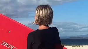 DWTS host Julianne Hough shows off her beach bum in a thong bikini on surf day with gal pals