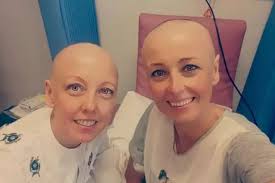 Two sisters who were diagnosed with cancer six weeks apart praying for  all-clear