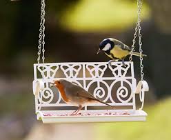 The swinging style and hanging ropes act as a deterrent to larger birds Buy Modern Metal Garden Swing Seat Hanging Bird Feeder Bird Table Feeding Station Online In Kuwait 303302379211