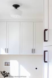 Do you find yourself sitting around your kitchen and instantly feeling like you are stuck back in the 80's? Fixer Upper Update Cabinet Hardware The Wood Grain Cottage