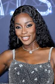 AJ Odudu shows off her incredible figure in a dazzling £3,500 silver gown  as she attends the premiere of Beyoncé's Renaissance film