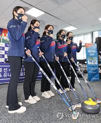 Scotland skip bruce mouat, right, bumps fists with team canada third darren moulding after defeating team canada in the qualification round at the men's world curling championships in calgary, alta., friday, april 9, 2021. S Korean National Women S Curling Team Yonhap News Agency