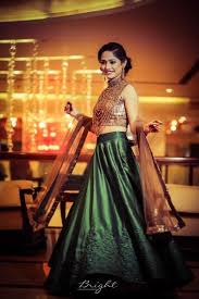 Photo Of Gold And Bottle Green Lehenga Green Lehenga Shimmery Dress Indian Wedding Dress